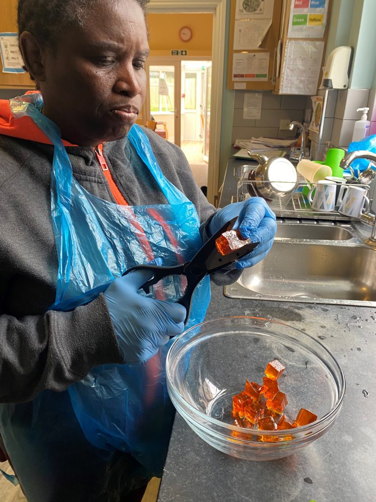 Person we support baking in the kitchen