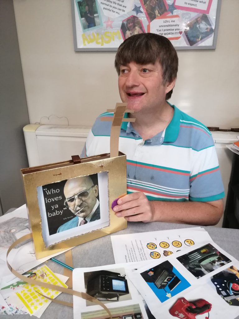 Andrew holding his homemade crafted television