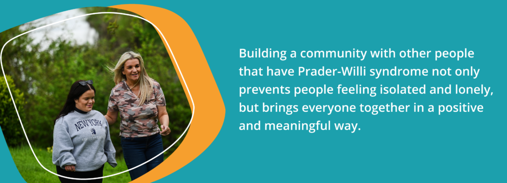 Two people outdoors with text saying "Building a community with other people that have Prader-Willi syndrome not only prevents people feeling isolated and lonely, but brings everyone together in a positive and meaningful way."